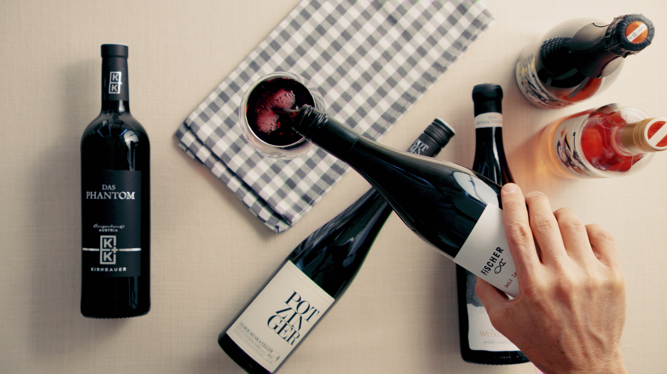 Austrian Wine bottles and pouring a glass of austrian red wine