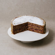 Slice of gluten-free buckwheat cake showing dense texture and jam layer