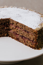 Top view of Austrian buckwheat lingonberry cake on cake stand