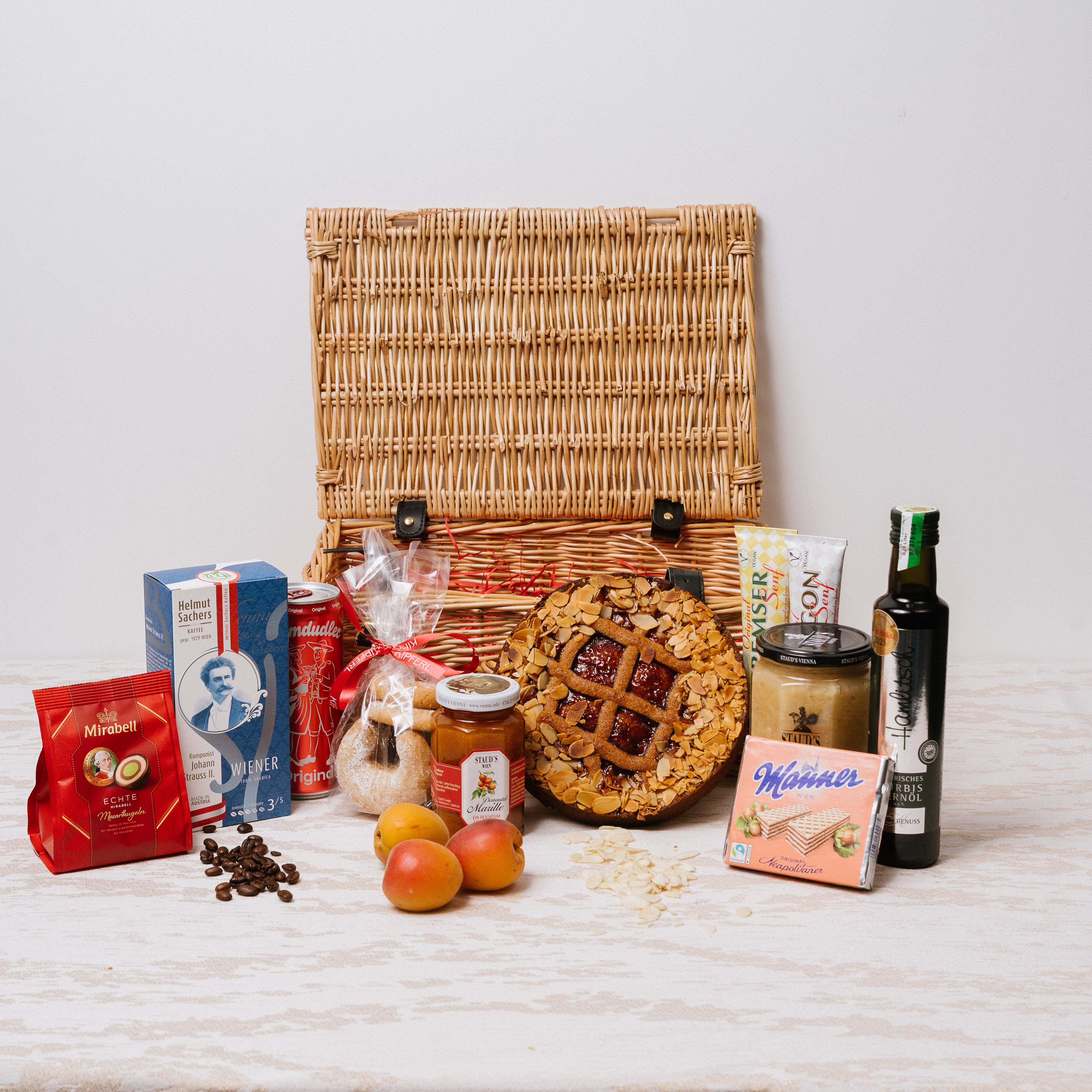 Alcohol-free Austrian gift hamper in wicker basket with full Austrian pantry