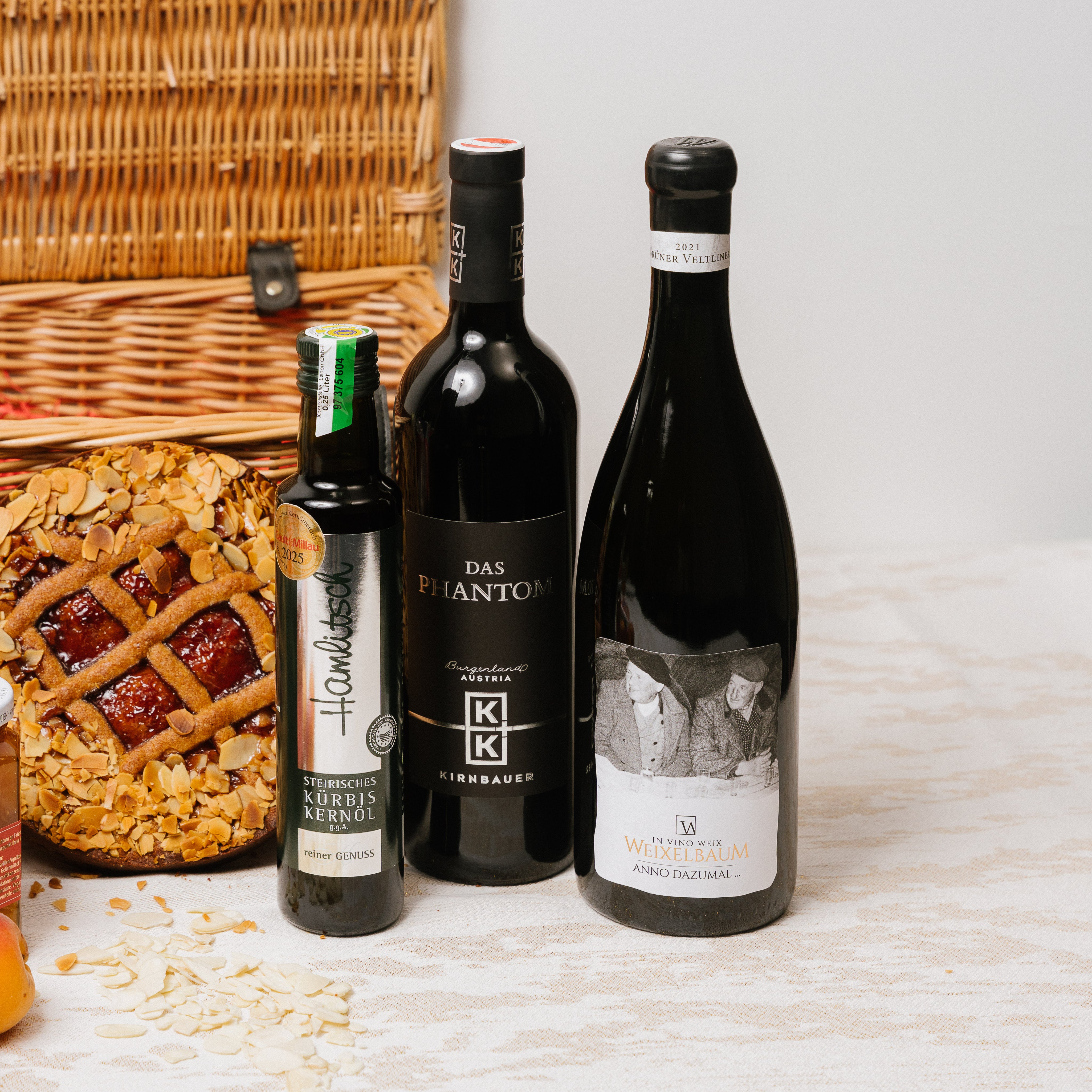 Austrian Excellence hamper contents arranged showing Linzer Torte, Vanillekipferl and Vienna pantry items