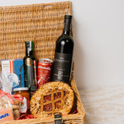 Austrian Excellence hamper presented in wicker basket finished with ribbon