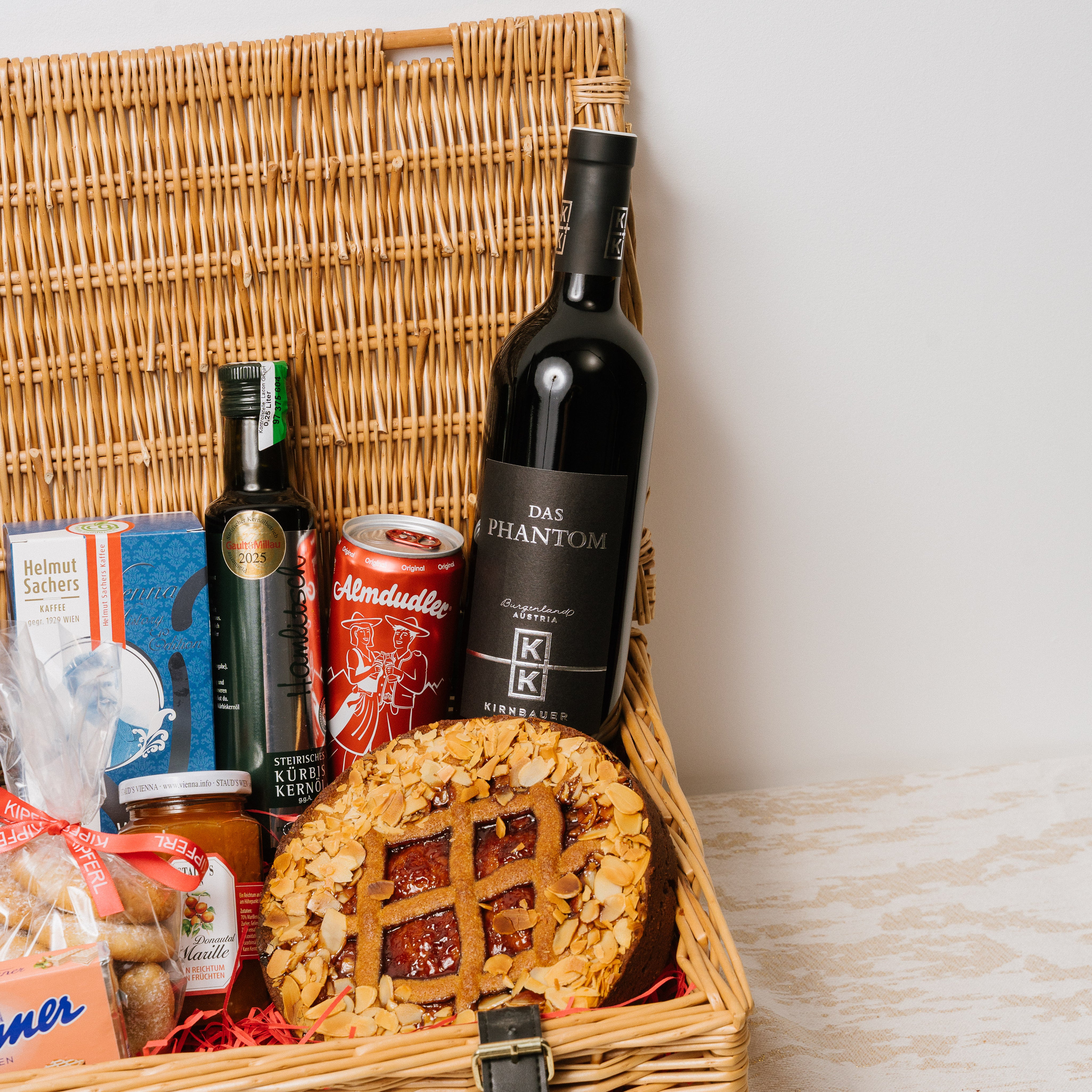 Austrian Excellence hamper presented in wicker basket finished with ribbon