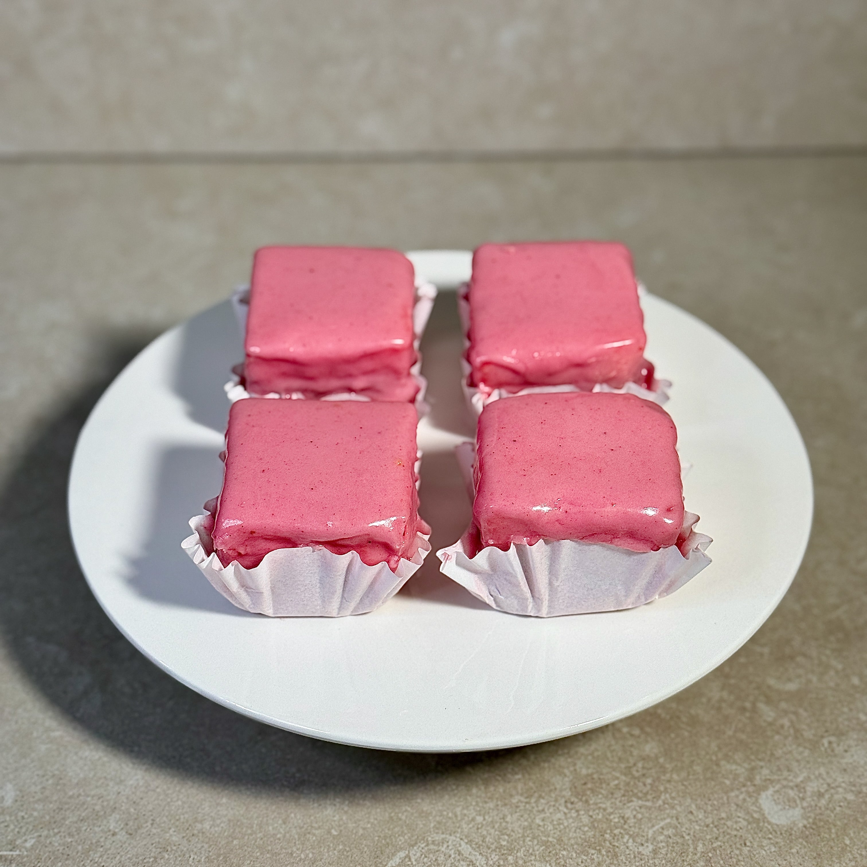 Traditional Viennese Punschkrapferl with pink icing and apricot filling